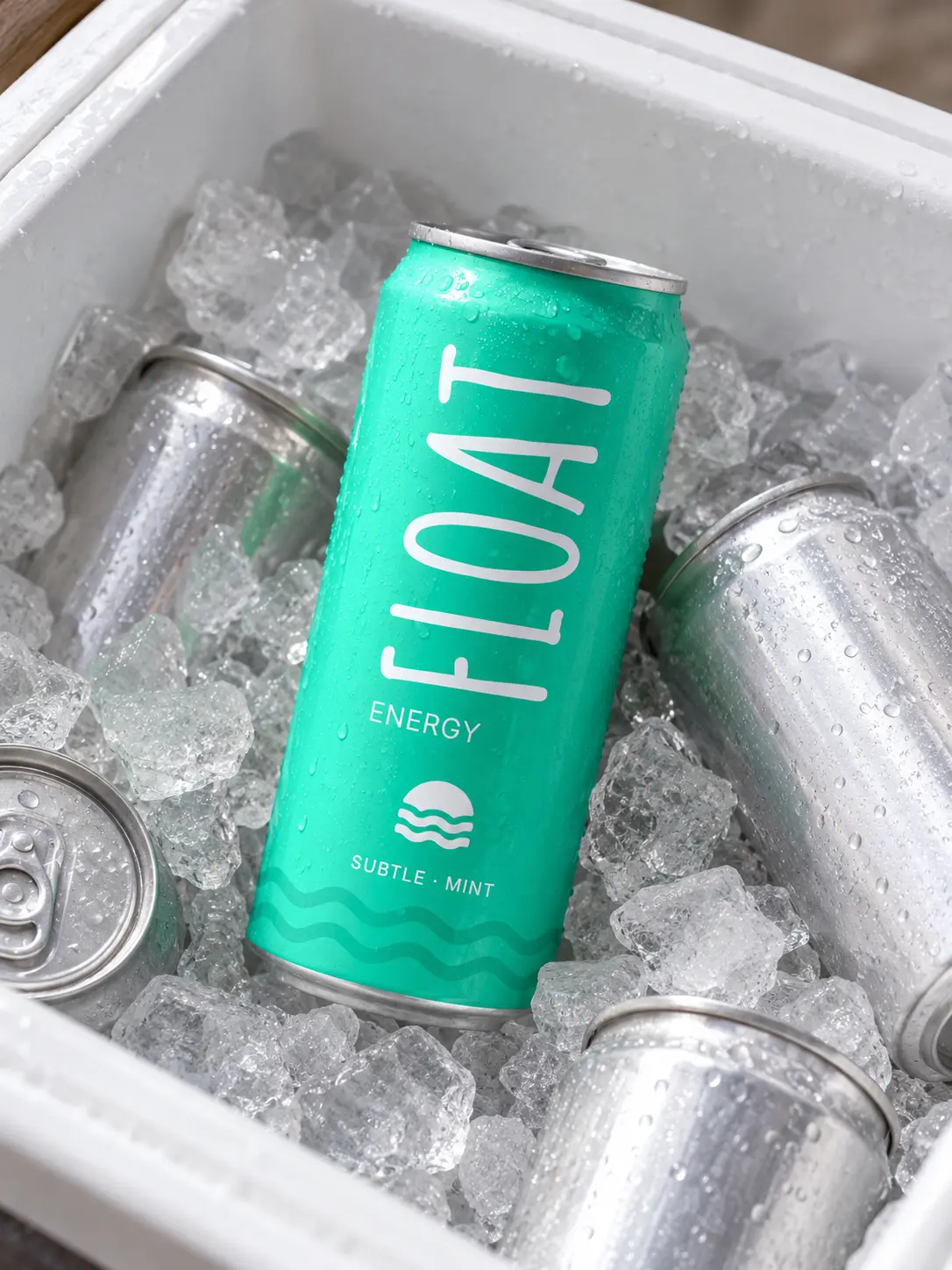 The Subtle Mint can standing in crushed ice in a white cooler box