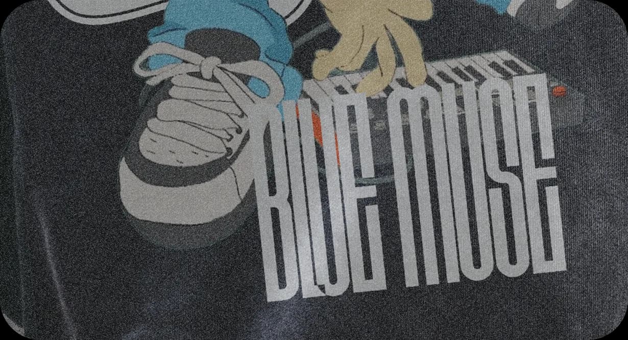 Close-up of the hoodie print: a sneaker, the keyboard and BLUE MUSE in tall condensed letters.