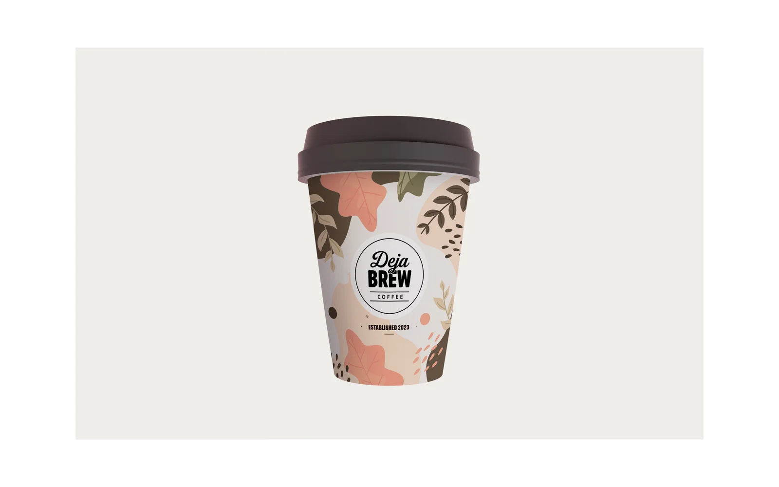 The takeaway cup, patterned in terracotta and brown leaves, with the badge and ‘Established 2023’.