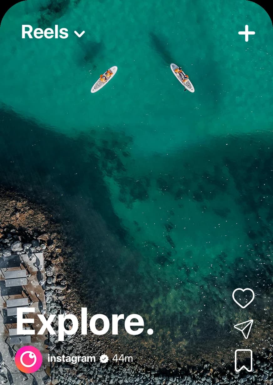 The reels feed with the new mark by the account name: an aerial shot of paddleboarders over clear water, captioned Explore
