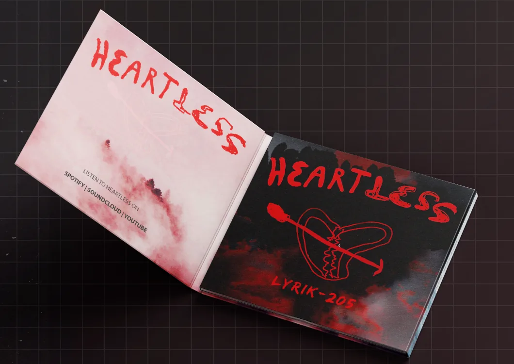 The Heartless digipack open: the lettering on a pale pink inside, the cover on the right.